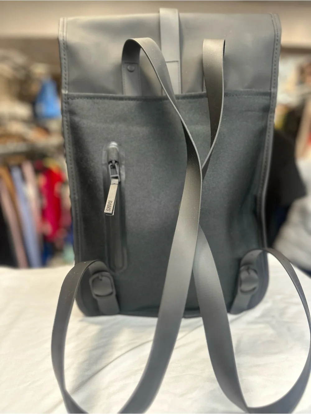 Rains  Backpack is clean and ever-contemporary. Like new no tag